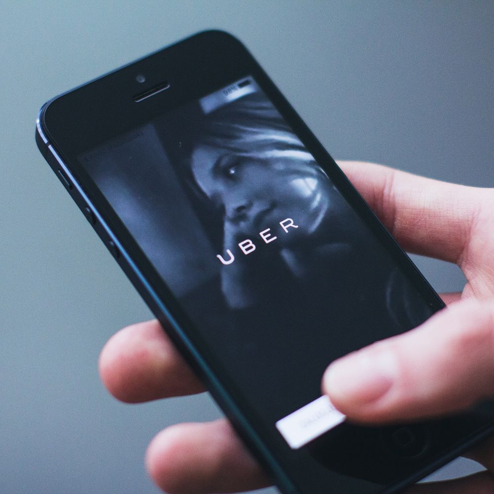 Person ordering an Uber | Lyft Accident Attorney